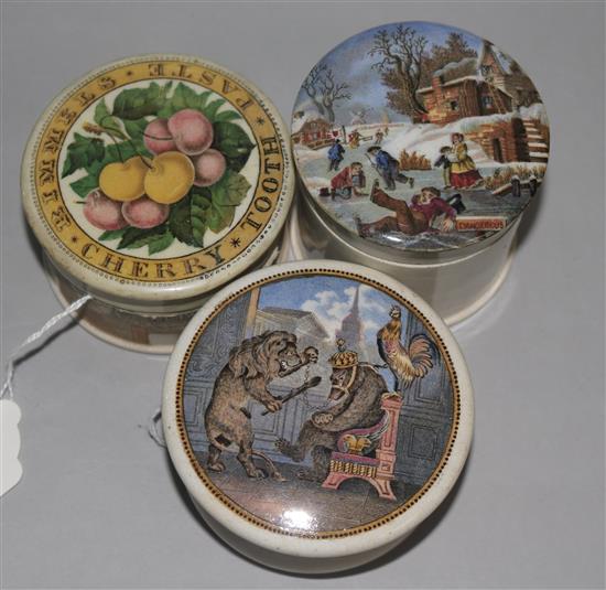 Three Prattware pot lids and bases, Bunch of Cherries (126), Bear, Lion & Cock (19) and Dangerous Skating (249)